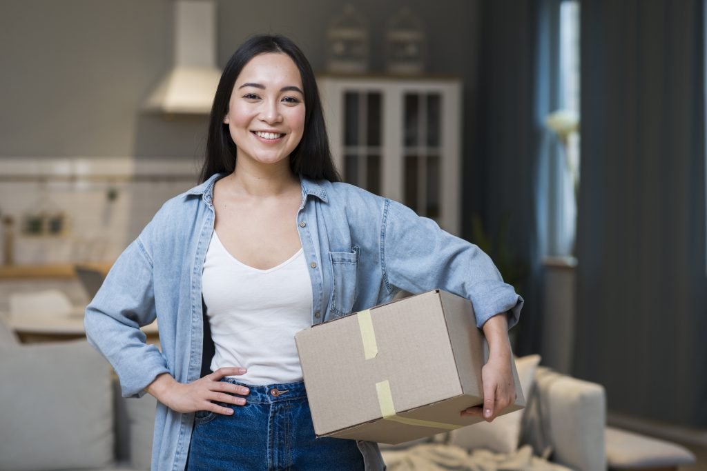 woman smiling holding parcel